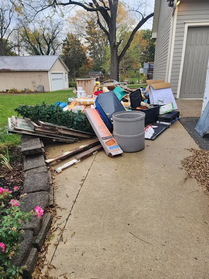 Dumpster being loaded with debris for Demolition Dumpster Rental in East Hampton